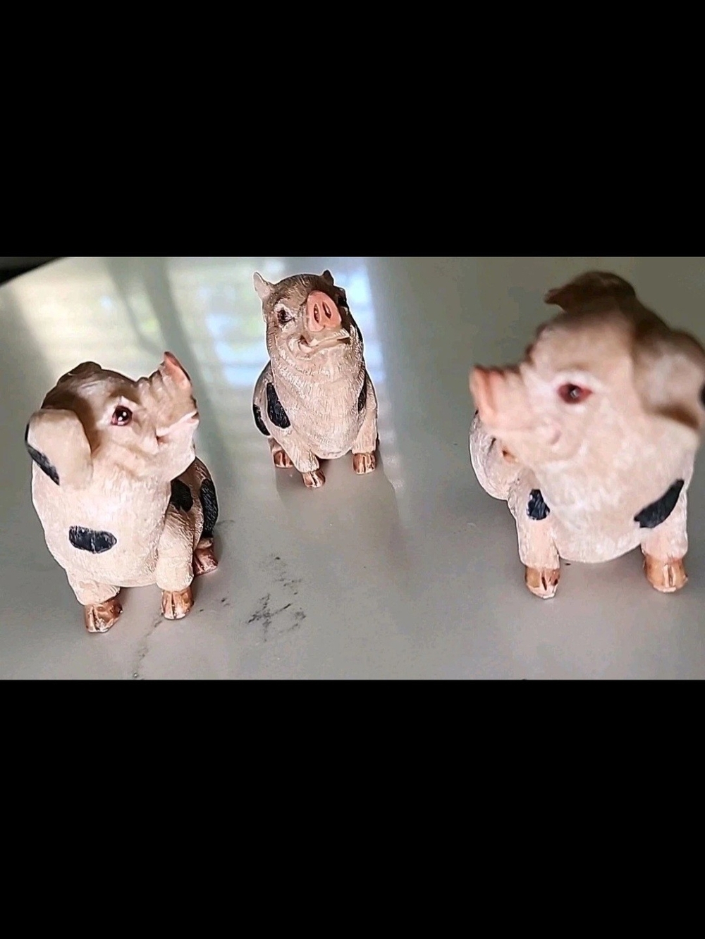 Three-Piece Pink and Black Pig Figurine Collectable Set Of 3